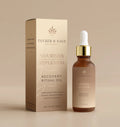 A bottle of Recovery Ritual Oil with a dropper is shown beside its beige packaging—formulated with botanical ingredients to deliver ultimate skin nourishment.